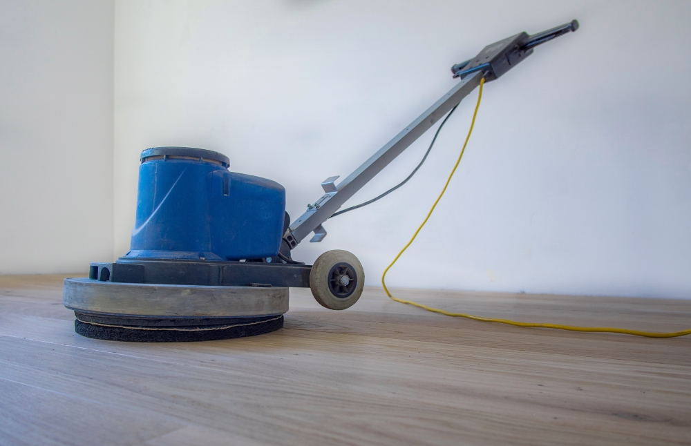 Buff the floor with a buffer or polisher using a fine-grit screen or pad.